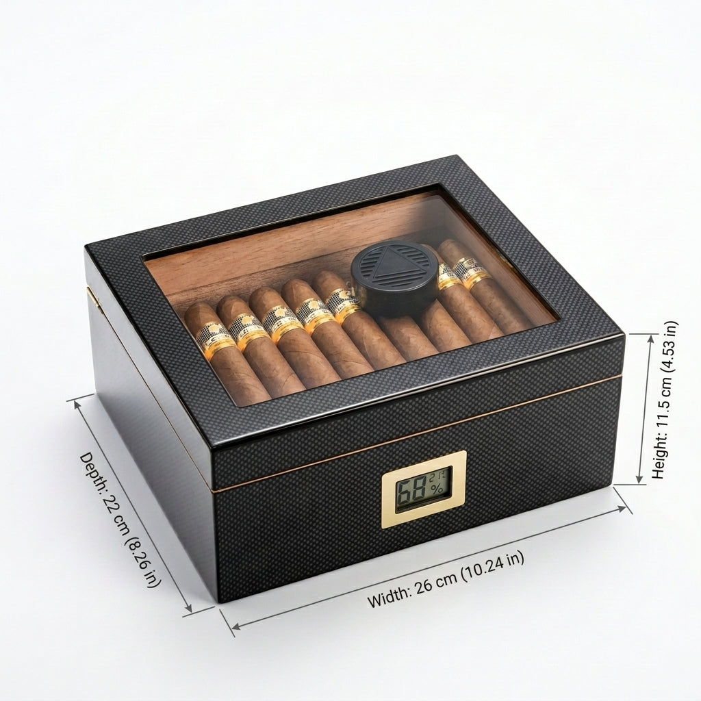 Carbon fiber glass-top cigar humidor with digital hygrometer and technical dimension lines on a white background.
