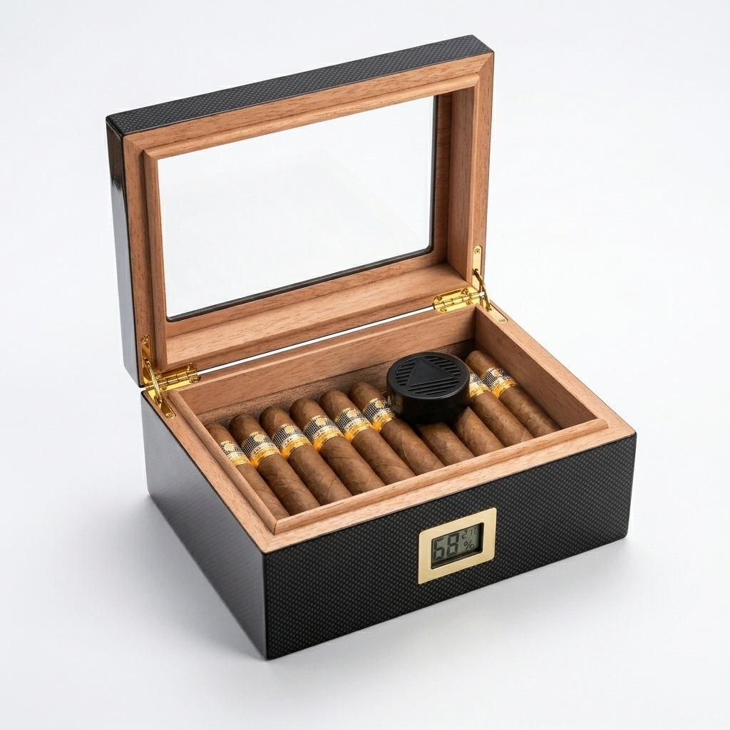 Open carbon fiber cigar humidor showing cedar wood interior lining and gold hinges. Desktop humidor filled with premium cigars, featuring a digital hygrometer at 68% and humidifier disc.