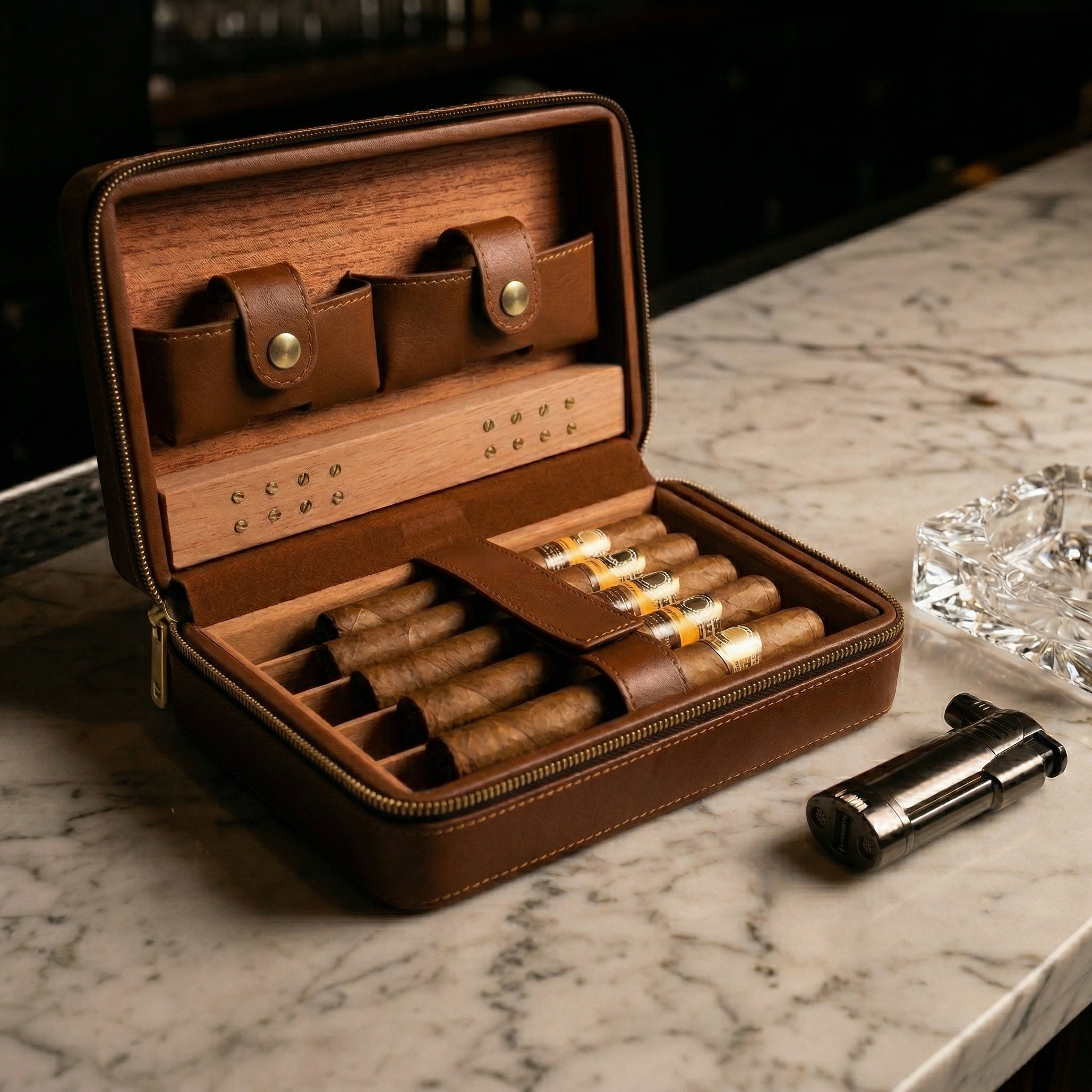 Premium leather travel cigar case with Spanish cedar lining and built-in humidifier. Securely holds 5 cigars with dedicated slots for a lighter and cutter, perfect for travel and cigar preservation on the go.