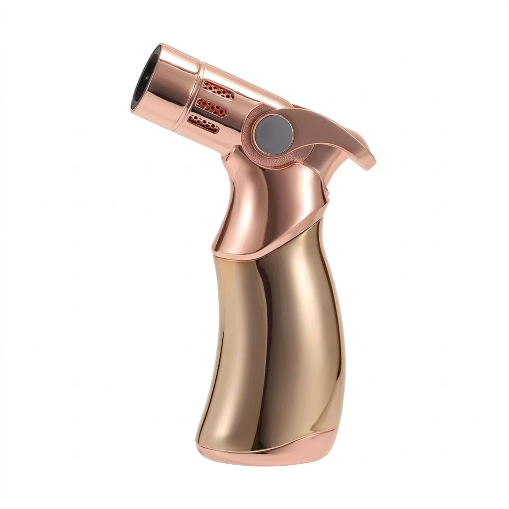 Luxury rose gold cigar torch lighter on marble table with whisky - premium cigar accessory
